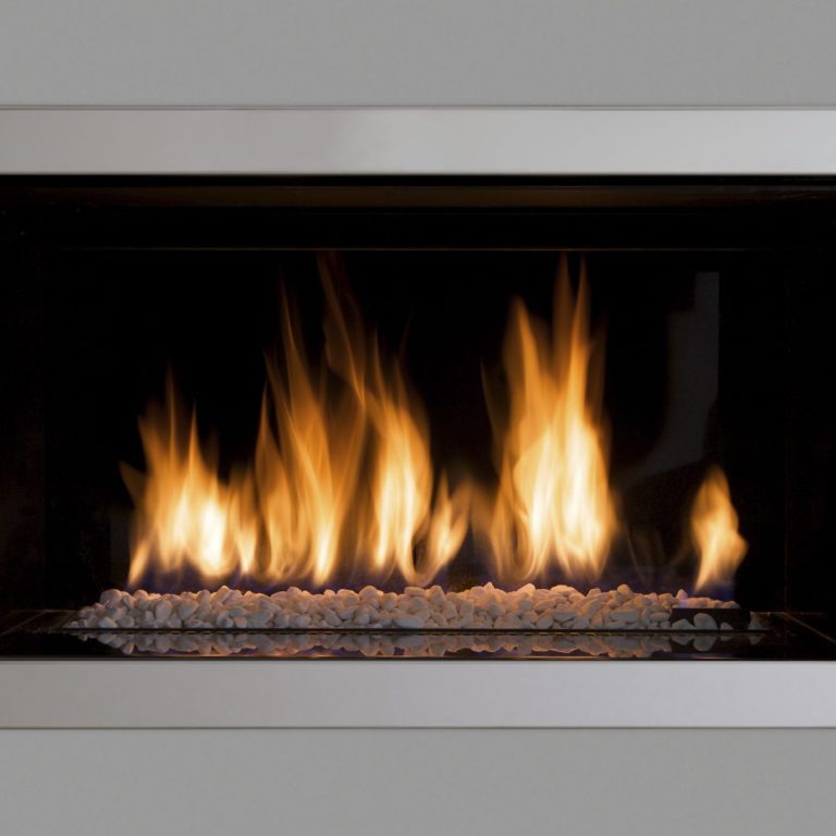 Log burning fireplace media wall installation.
